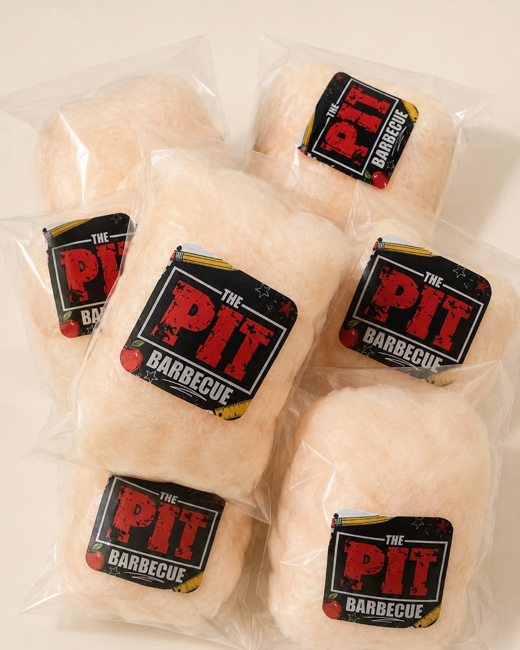 Individually packaged cotton candy favors with custom branded labels