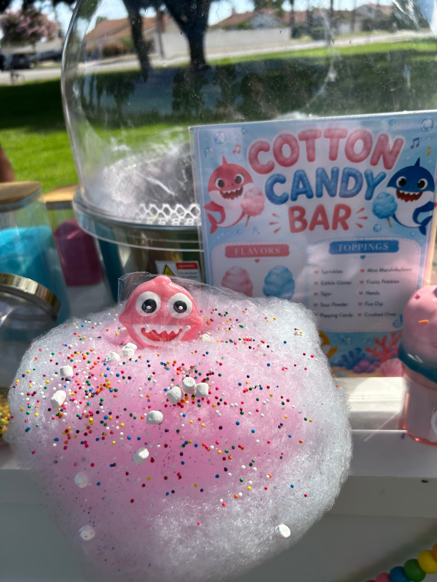 Baby Shark themed cotton candy bar with pink floss and sprinkles