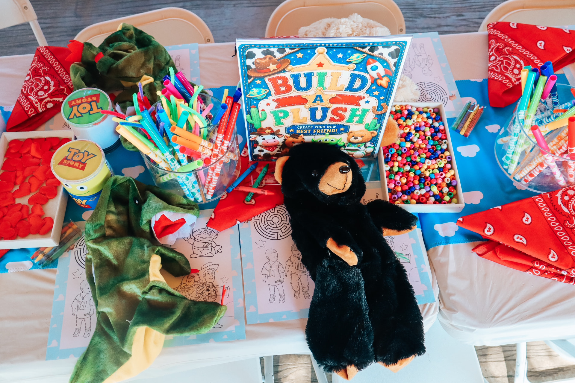 Toy Story-themed build a plush activity table