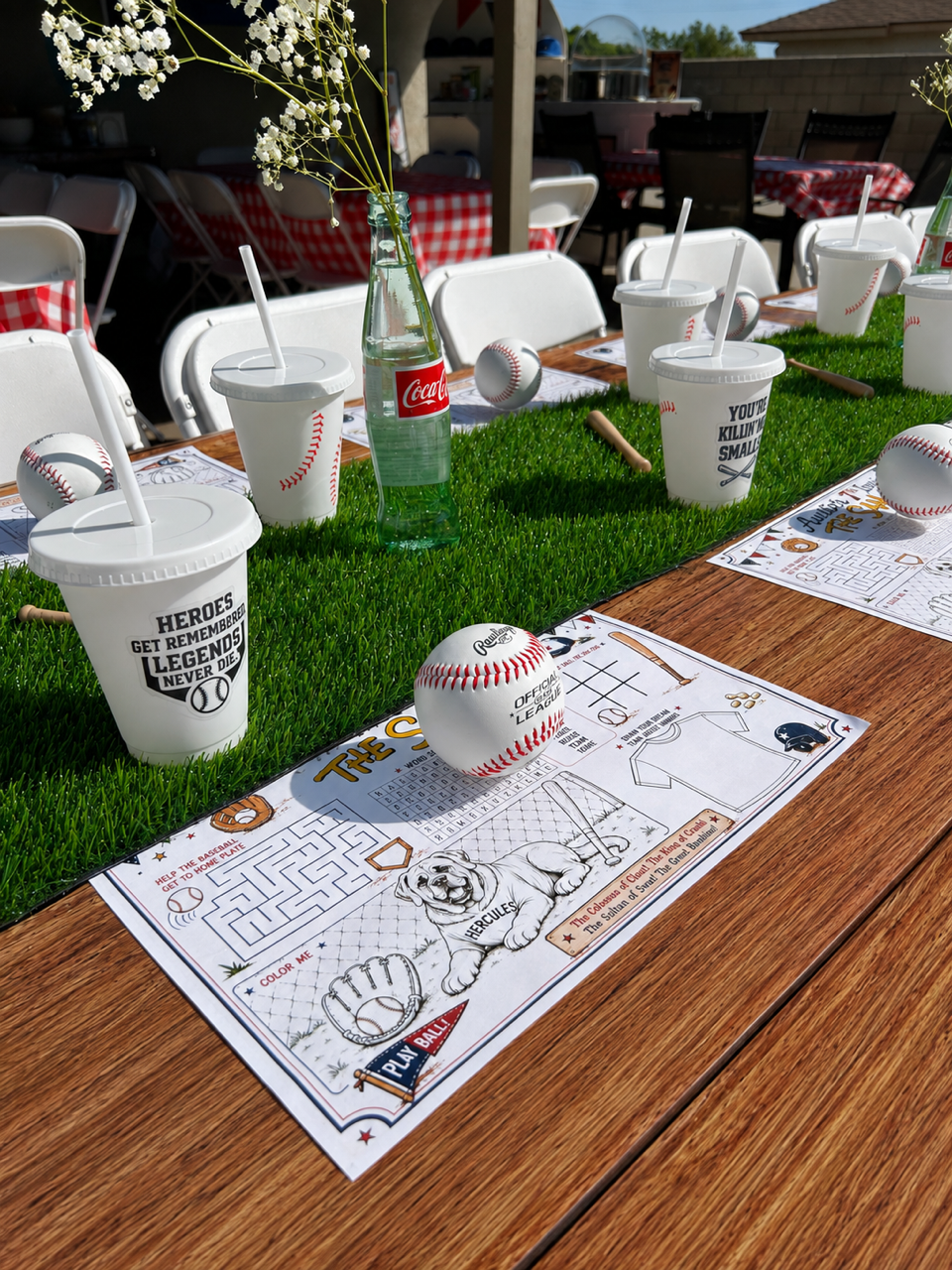Baseball-themed arts and crafts table with activity mats, custom cups and baseball decor