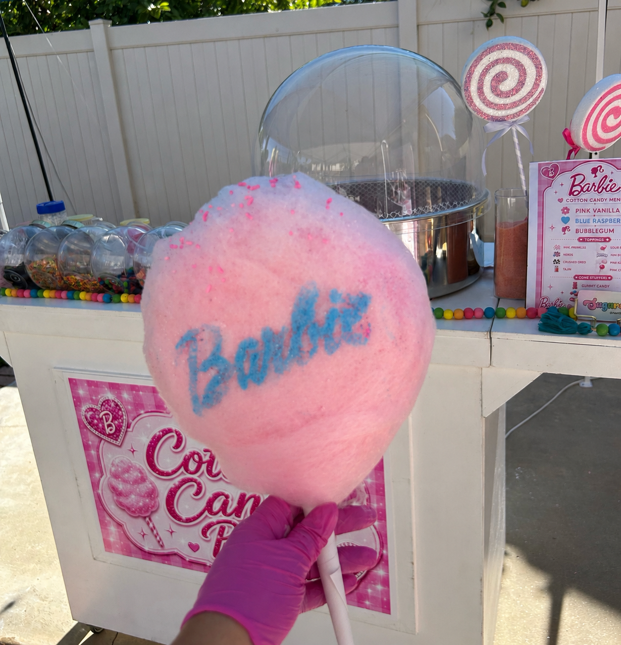 Barbie-themed cotton candy activation with custom-branded floss, toppings bar, and professional cart setup